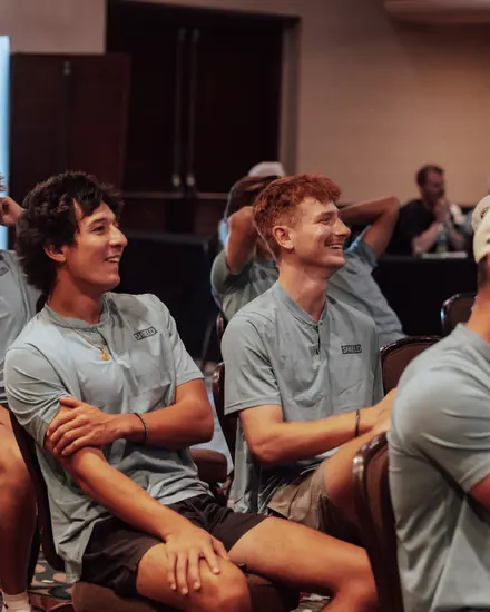 Two reps laughing during a meeting