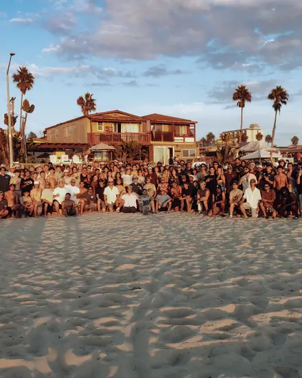 The full sales team together on the beach
